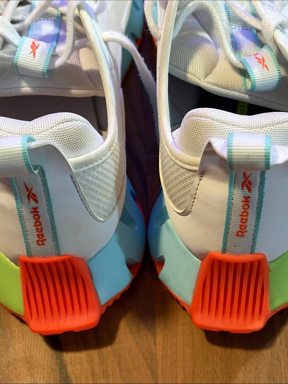 Reebok Kids White Sneakers with Teal and Orange Accents